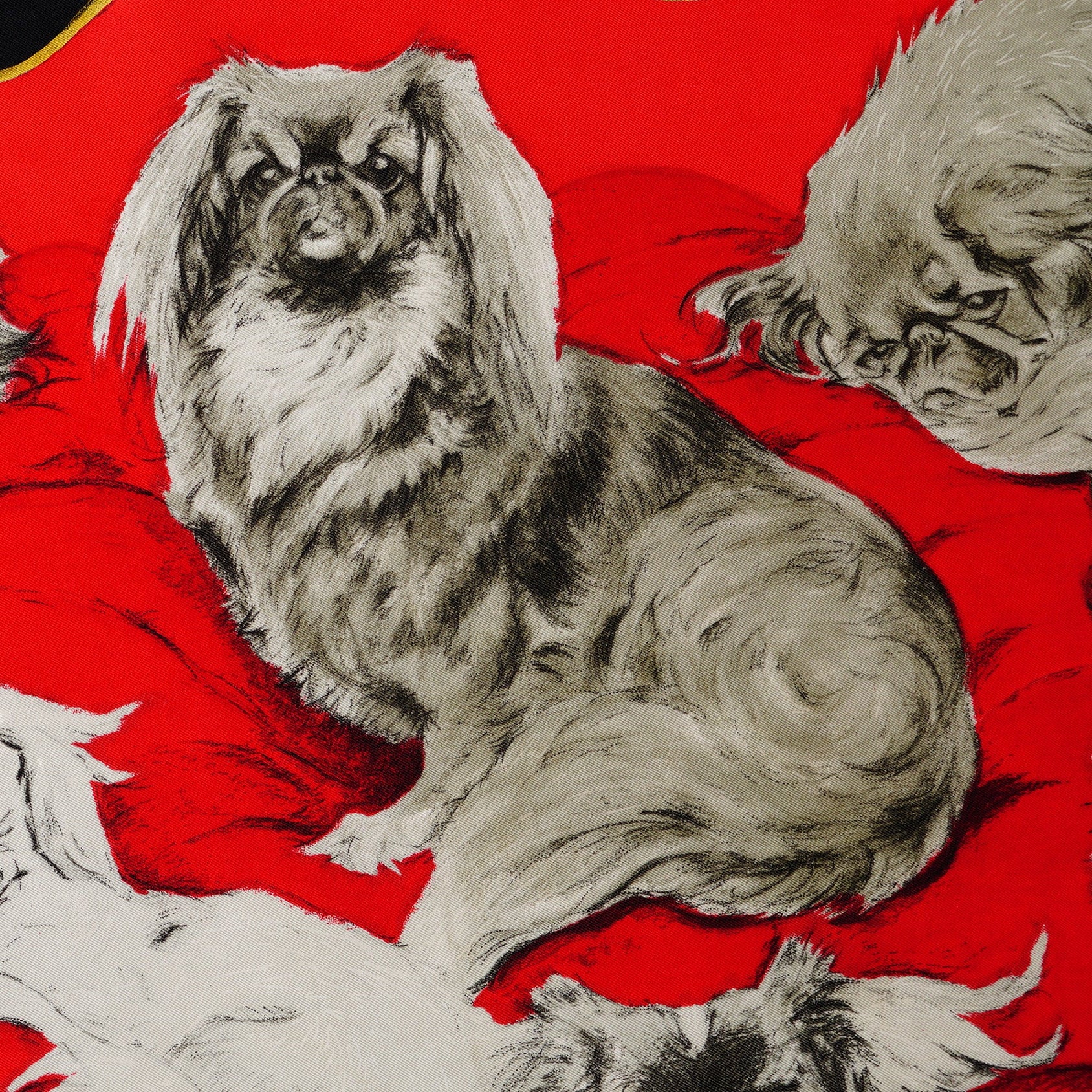 Zoom sur les illustrations de chien de face  du foulard Hermès Pékinois 1965.